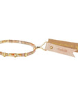 Tortoise shell bracelets with gold engraved charm and reusable leather hang tag stamped with "fearless".