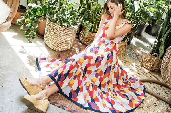 Multi colored maxi dress on model paired with espadrilles.