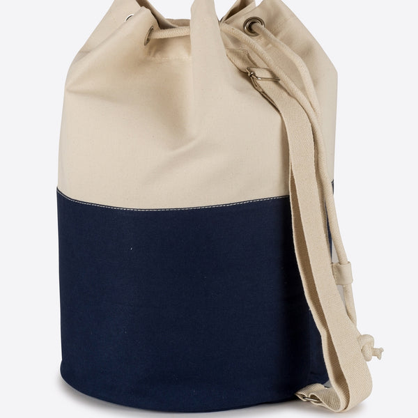 Canvas laundry tote bag. Navy and natural with shoulder strap and drawstring.