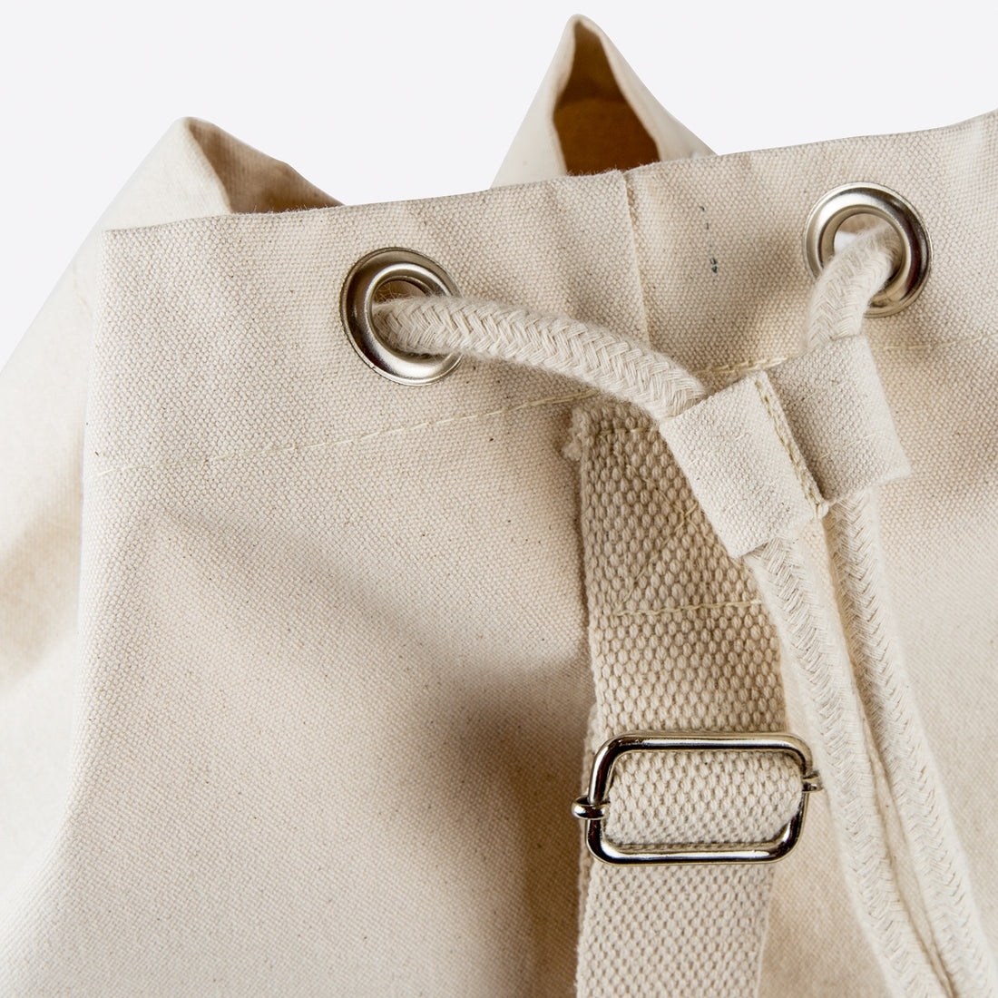 Canvas laundry tote bag. Rope drawstring closure.