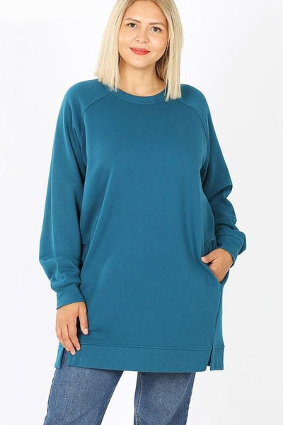 Women's plus size long sweatshirt tunic shown in teal color on plus size model. Great length for coverage with leggings or jeans.
