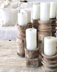 Grouping of pillar candle holder tall and short.