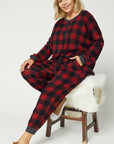 Plus size red plaid pajamas worn with matching top.