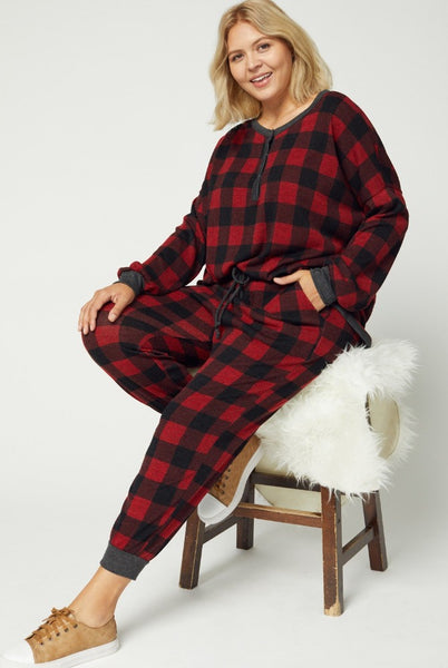 Plus size red plaid pajamas worn with matching top.