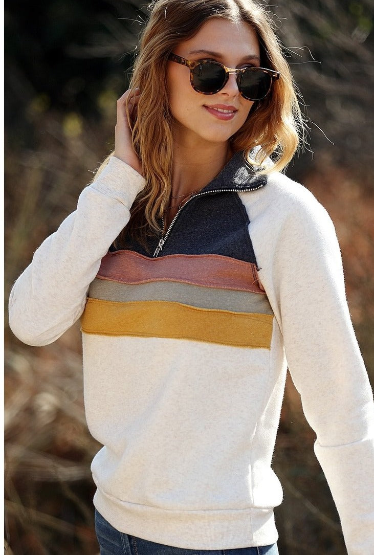 Retro striped pullover - women&#39;s top paired with denim.