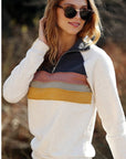 Retro striped pullover - women's top paired with denim.