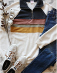 Retro striped pullover - women's top shown with jeans and white sneakers.