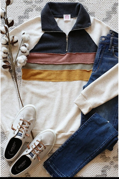 Retro striped pullover - women's top shown with jeans and white sneakers.
