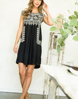 Women's Embroidered Black Dress. Sleeveless with pale gold embroidery.