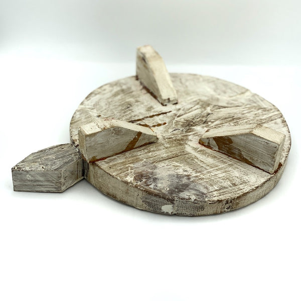 Under side of small wooden display stand.