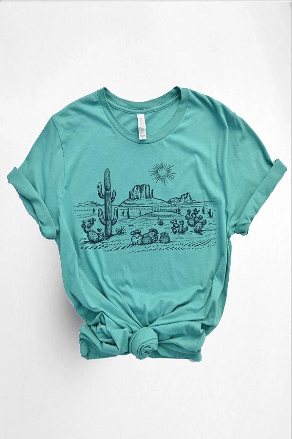 Women's cactus tee with vintage desert scene on aqua colored t-shirt.