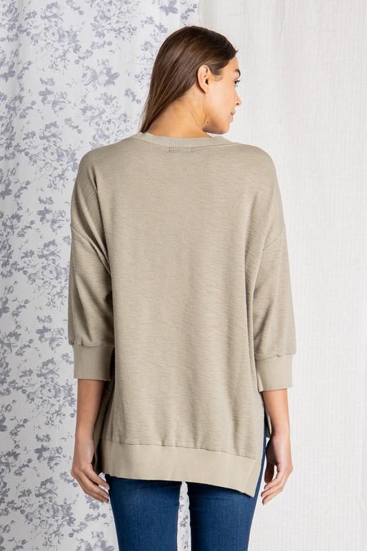 Women&#39;s loose fit tops. Back view.