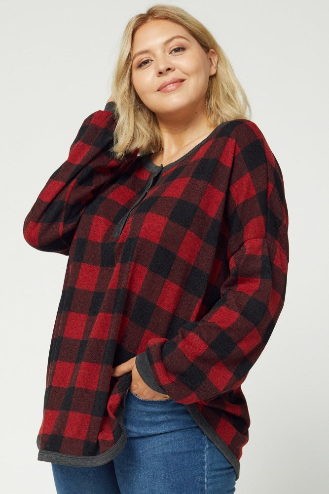 Women&#39;s plus size buffalo plaid pajamas paired with jeans.