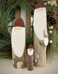 Three wooden Santa logs in small, medium, and large sizes. Large is 9-16 inches tall.