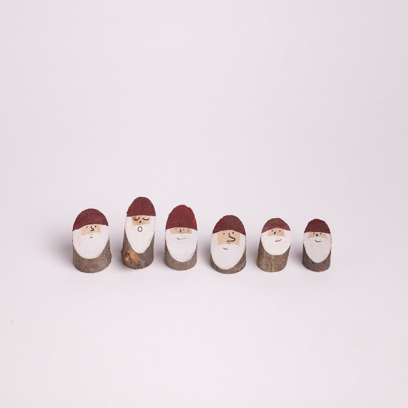 Wooden Santa logs in x-small size. Under 1 inch tall.