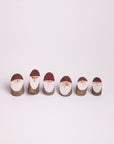 Wooden Santa logs in x-small size. Under 1 inch tall.