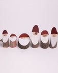 Wooden Santa logs in small size. 1-4 inches tall.