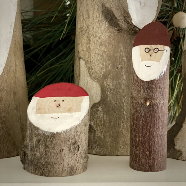 Two little wooden Santa logs buddies.